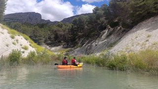 Person kayaking on the Guadalest Reservoir